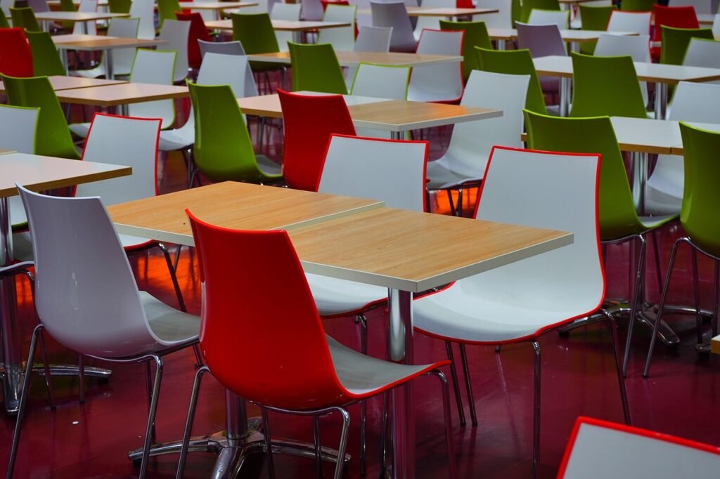 tables, chairs, sitting area, canteen, dining room, seating, red, green, canteen, canteen, canteen, canteen, canteen